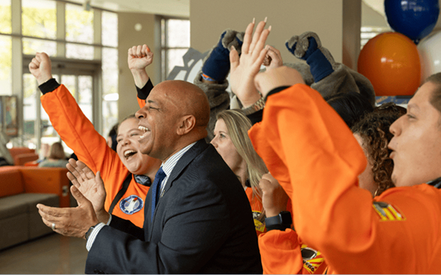 Business Titans cheering at an event